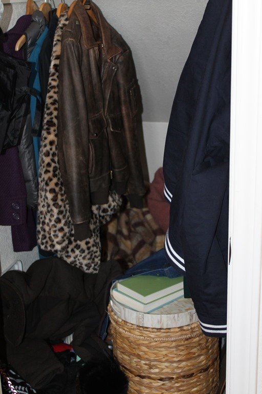 Crowded coat closet close up