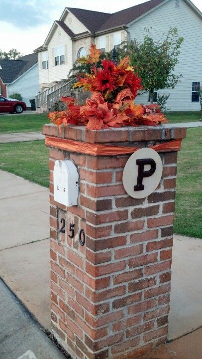Brick mailbox decorated for fall.