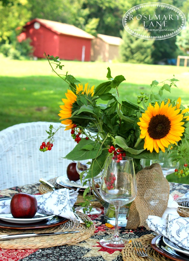 quilt, burlap and berries table setting